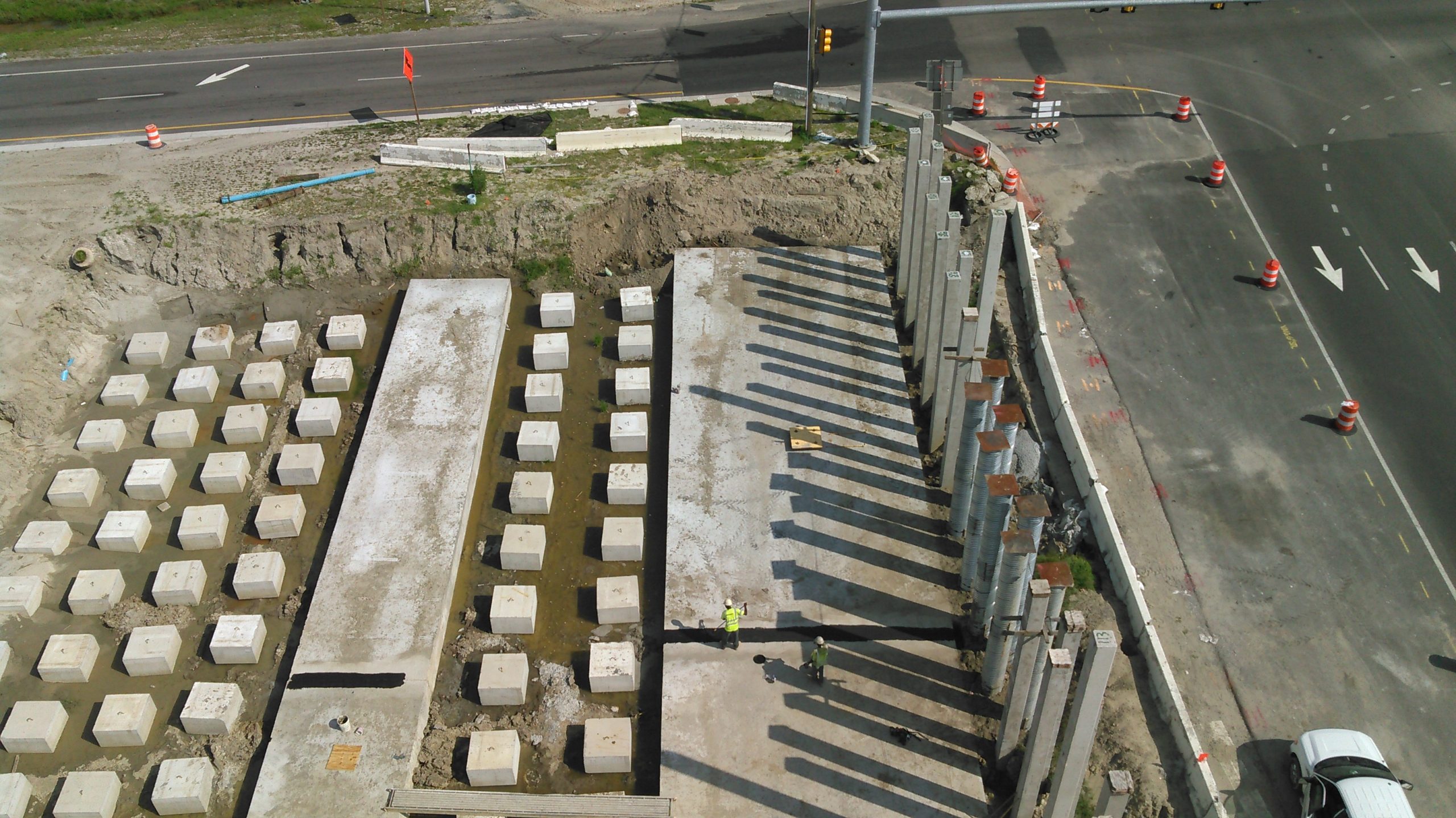 3-ft thick, pile-supported concrete utility slabs built to protect underground utilities from damage due to settlement