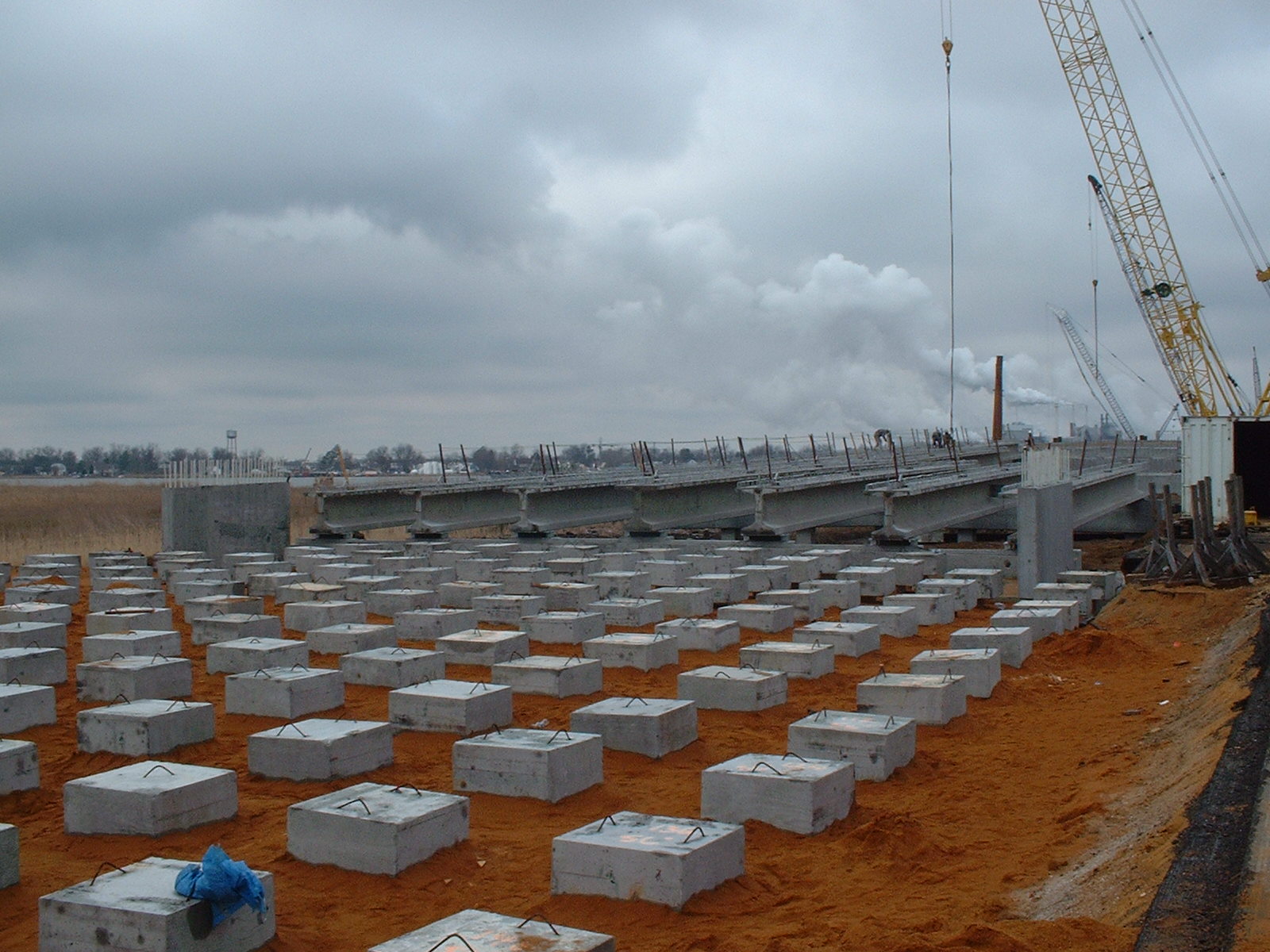 Bridge approach supported by concrete piles and precast concrete pile caps