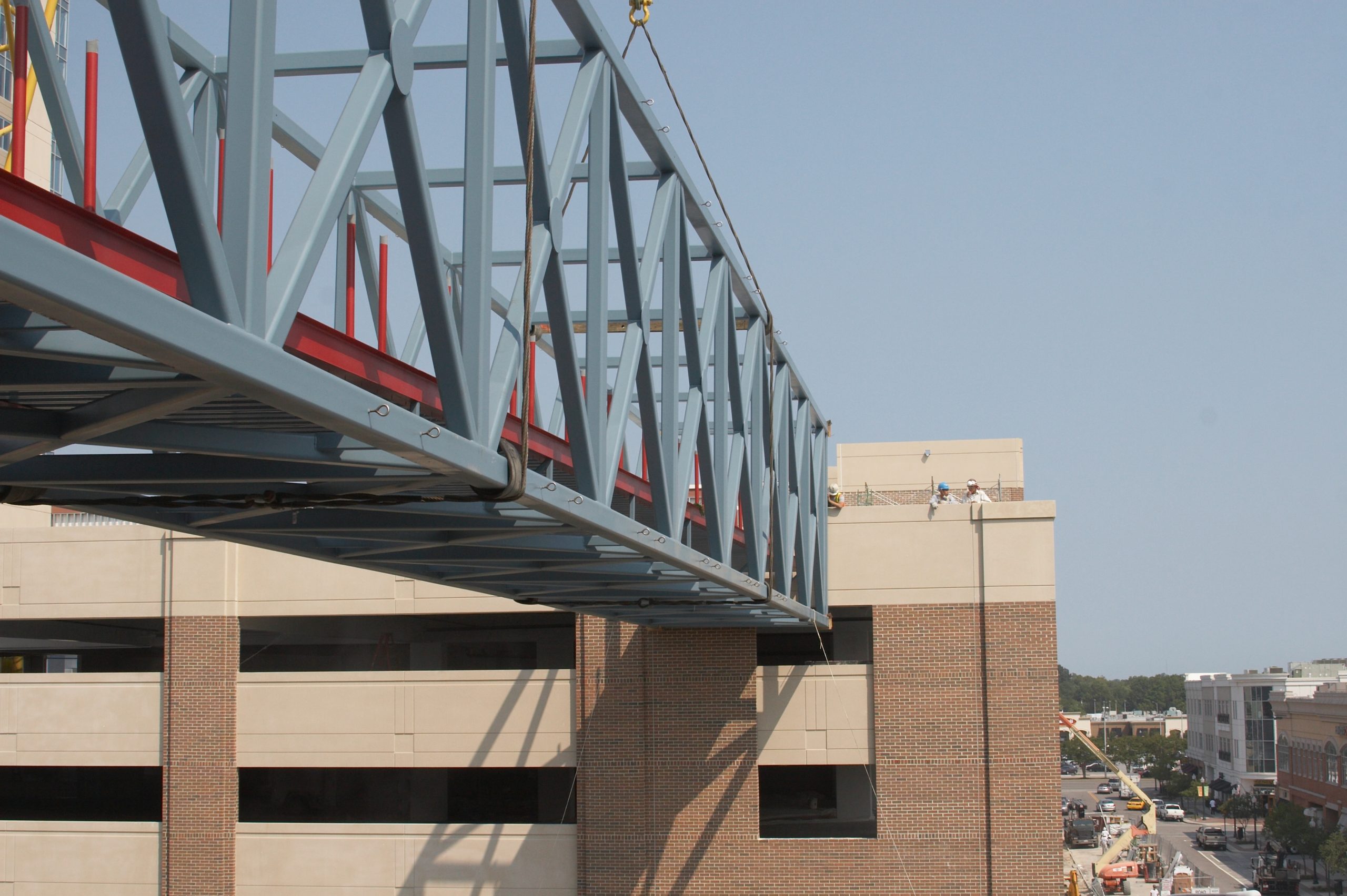 Lowering the bridge between two existing buildings