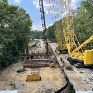 Driving Pier 5 bent piles from the temporary trestle.