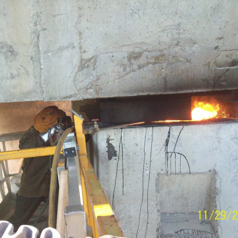 A lancing rod is used to remove an existing brige bearing.